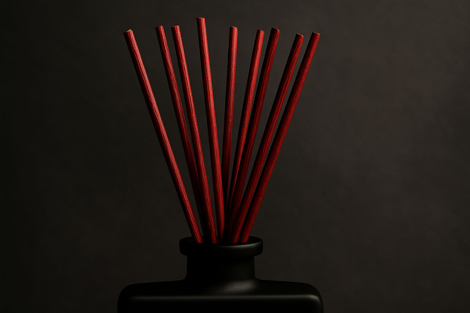 What Are Fiber Reeds? And Why You Should Care JURGENS CODE oxblood fiber reeds in matte black diffuser close-up on slate backdrop